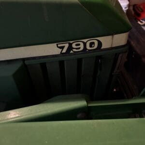 IMG_1396 1 - Montana Auctions by Kevin Hill Front view of a green tractor with the model number 790 on the hood badge.