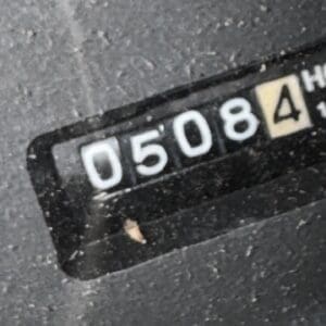 IMG_1396 3 - Montana Auctions by Kevin Hill Close-up of a black numeric counter showing digits 05084 on a dusty surface