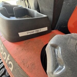 Forklift fuel area with a labeled 'Diesel ONLY' slotry near the seat and red body panel nearby