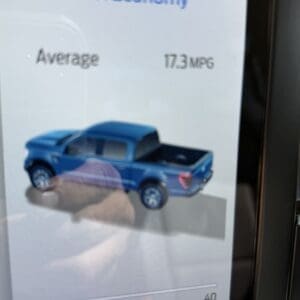 Fuel Economy screen showing average 17.3 MPG and a blue pickup graphic with a 0–40 MPG slider below