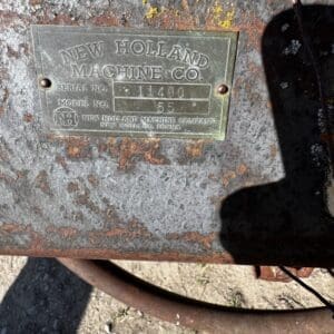 LOT 2 4 - Montana Auctions by Kevin Hill Rusted metal plate on an old New Holland machine showing serial 11490 and model 55.