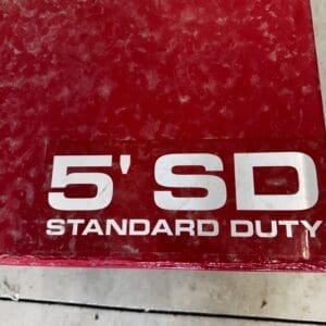 LOT 9 3 - Montana Auctions by Kevin Hill Close-up of a red box label that reads '5' SD STANDARD DUTY' in white letters.