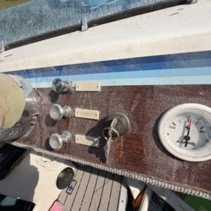16 4 - Montana Auctions by Kevin Hill Close-up of a boat’s control panel with labeled switches (Bilge Pump, Blower, Run Lights) and a round ammeter gauge.