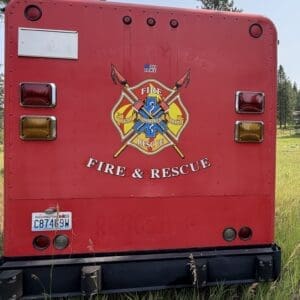 18 2 - Montana Auctions by Kevin Hill Rear of a red Fire & Rescue truck with emblem and the words 'FIRE & RESCUE' on the back. Washington state license plate visible at bottom left.