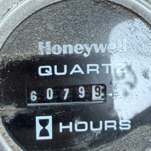 24 5 - Montana Auctions by Kevin Hill Dusty Honeywell quartz hour meter displaying its numeric hour readout.