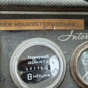 24 6 - Montana Auctions by Kevin Hill Close-up of a dusty Honeywell quartz hour meter on an industrial panel, showing the elapsed hours and a label reading 'New Hourmeter 6920HRS'.