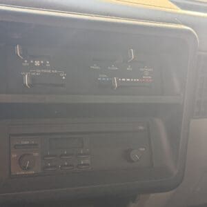 26 4 - Montana Auctions by Kevin Hill Old-style car dashboard: HVAC sliders and a cassette/radio unit in the center console